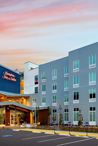 Modern hotel exterior at sunset