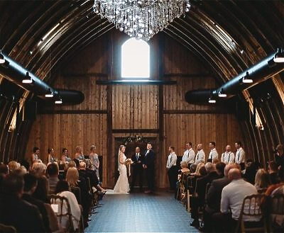 Elegant indoor ceremony setting at Vennebu Hill wedding venue in Baraboo Wisconsin