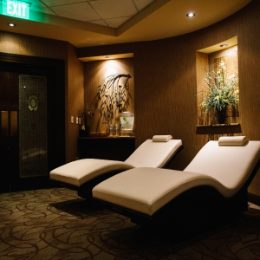 Spa relaxation area featuring two comfortable lounge chairs and soft lighting, ideal for unwinding.