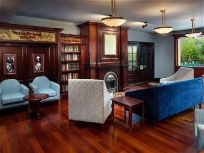 Irish Cottage Inn & Suites lobby with couch and chairs