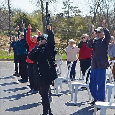 group participating in Tai Chi outdoors