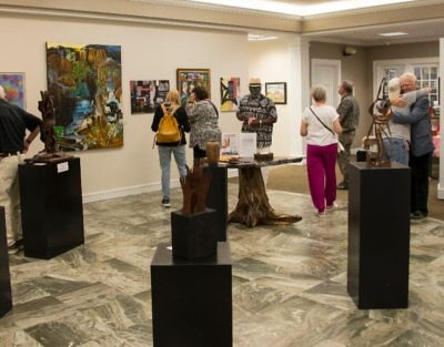 Visitors enjoying an art exhibition opening at the Galena Center for the Arts