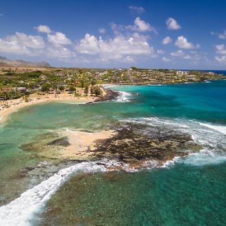 Aerial view of Lawai Beach on a sunny day