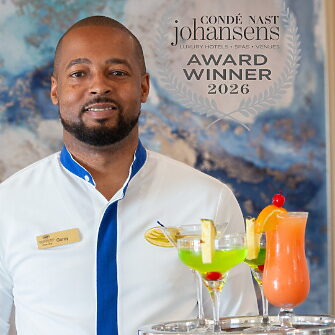 Man holding tray of cocktails