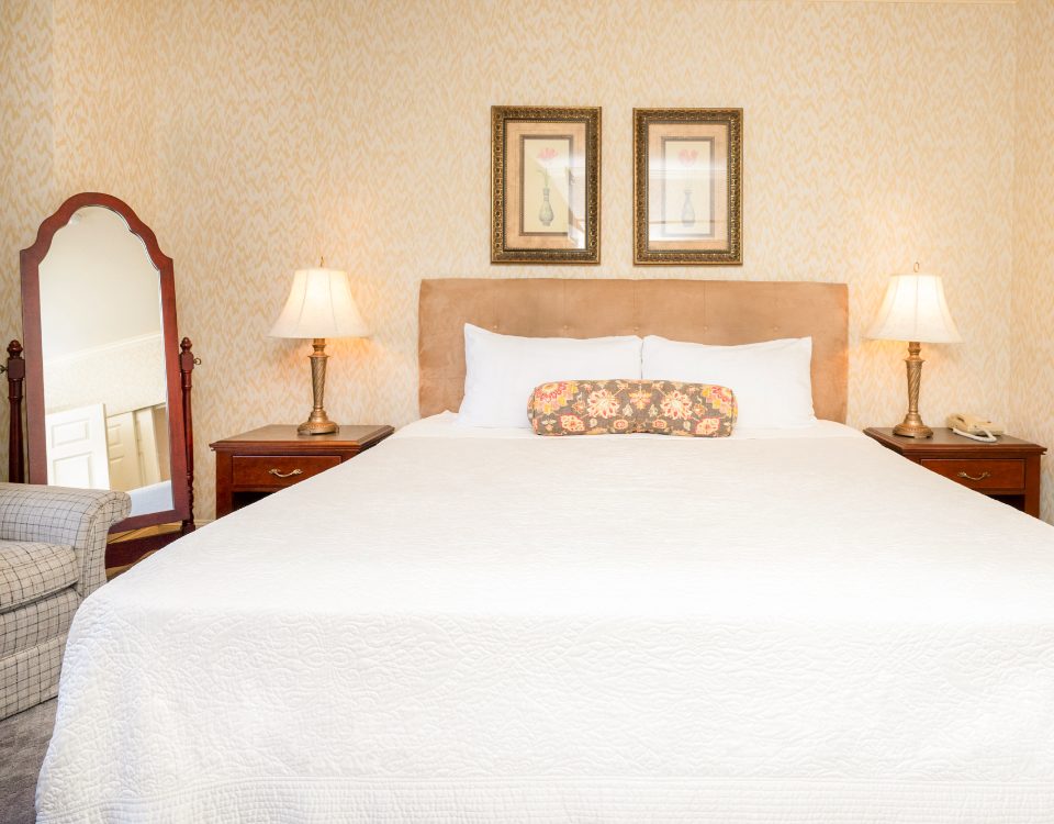 a hotel room wiht a king bed