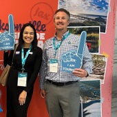 Two employees with foam fingers small