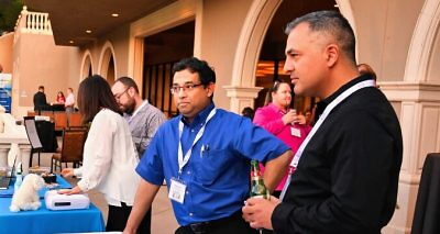 Team members standing at table large