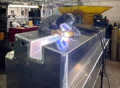 a row of boats docked on the water