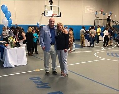 Daly Family in high school gym