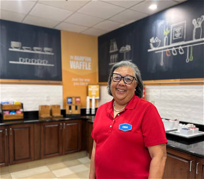 Woman working at hotel dining area